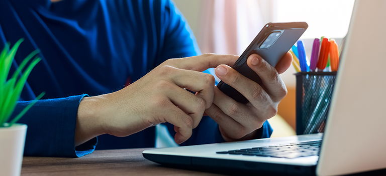 Regency Recruiting Employee on Phone Contact Us Header